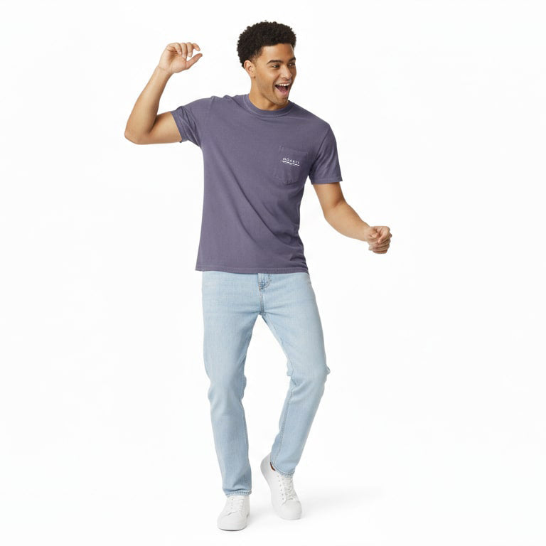 Man wearing a Moaki'i purple t-shirt and light blue jeans on a white background