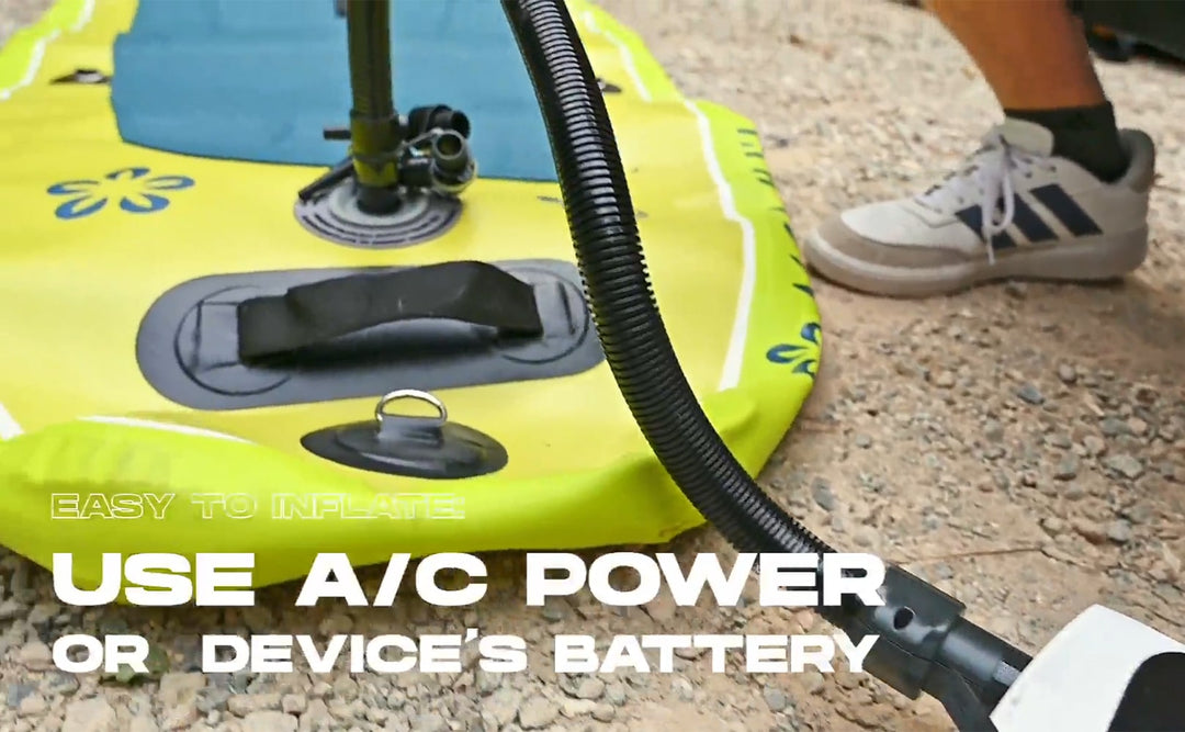 Inflatable boat with pump and text on a concrete surface