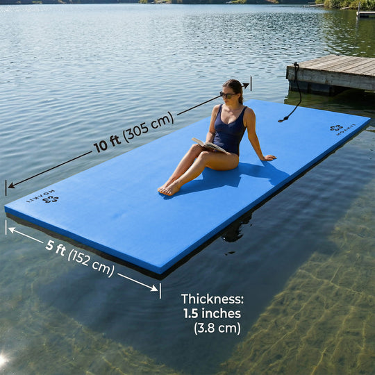 Woman sitting on a blue large floatation device in a lake with measurements indicated.