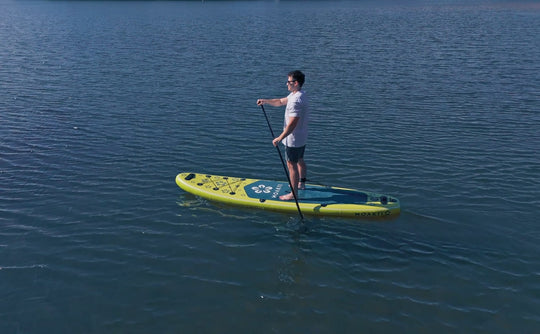 Drone shot of the Trekker 10'4" on a lake, emphasizing its compact shape.