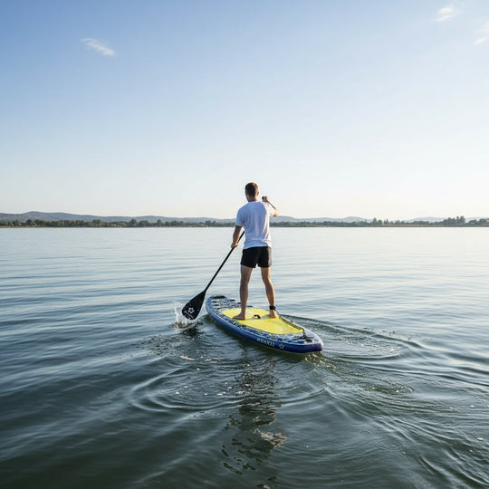 Rear view of a paddler on the Moaki'i Trekker, demonstrating smooth glide on calm lake water.