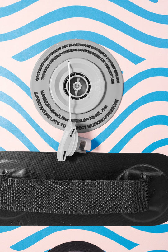 Close-up of the Trekker high-pressure H3 inflation valve and reinforced center carry handle.