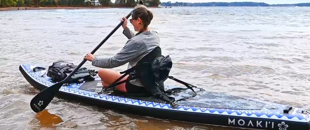 Person on a paddleboard with text 'Perfect for Choppy Days' on a lake.