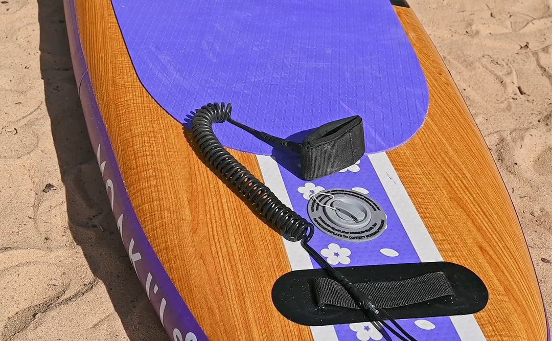 Detailed shot of the coiled safety leash attached to the Pathfinder's stainless steel rear D-ring.