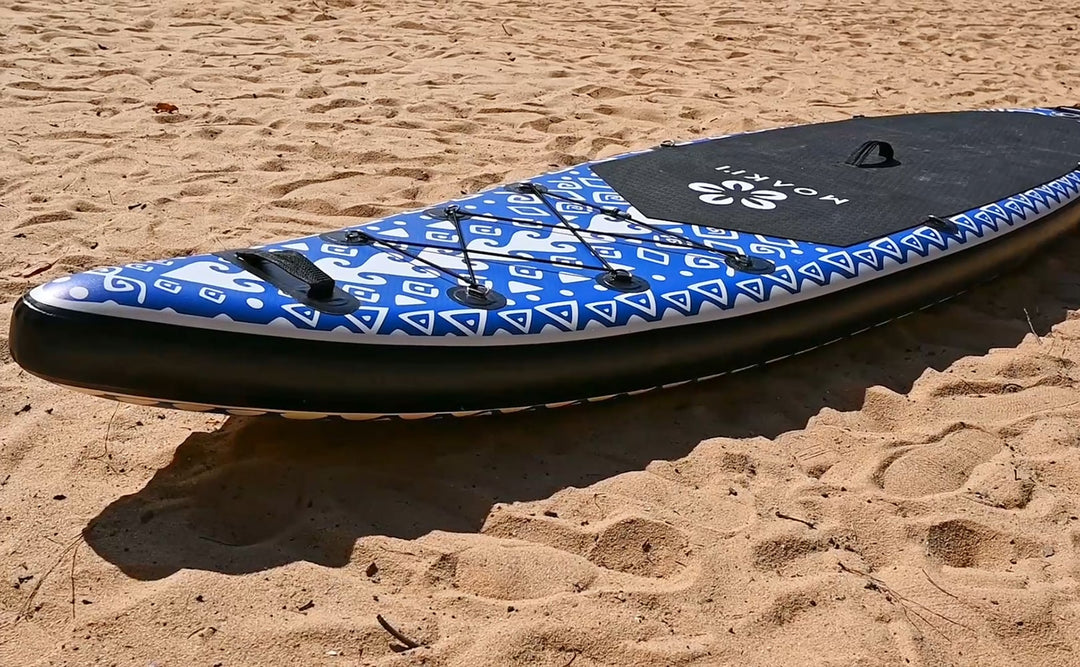 Side view of the Moaki'i Seeker resting on a beach, highlighting its durable construction