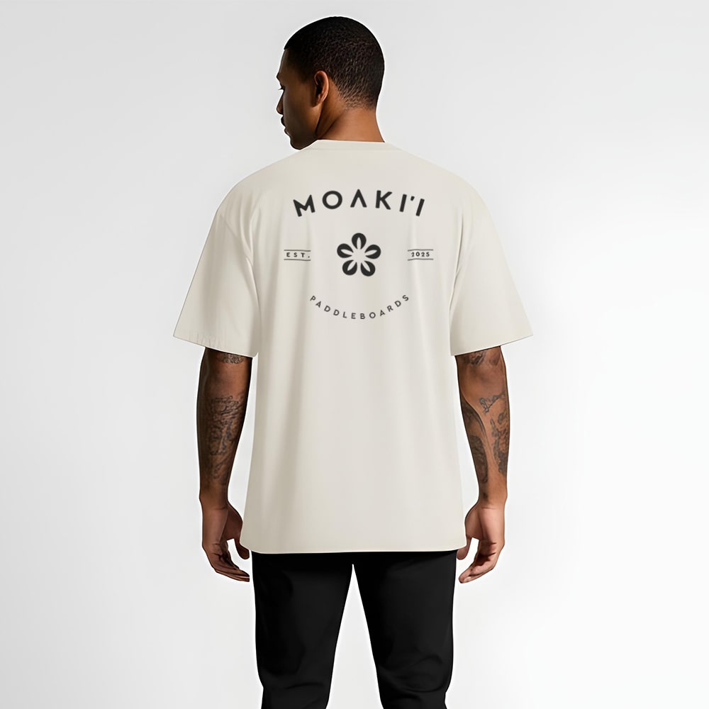 Person wearing a white t-shirt with Moaki logo on the back against a white background