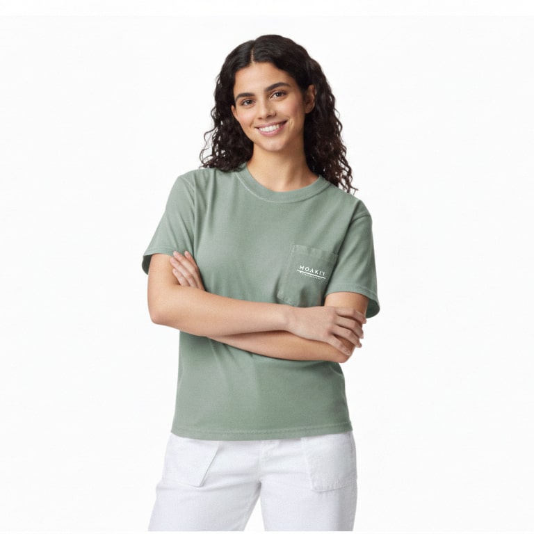 Woman wearing a green t-shirt with a logo on a white background