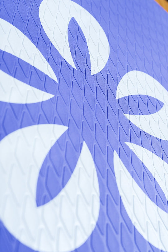 Detailed view of the Pathfinder's purple and blue non-slip EVA traction pad with Moaki'i floral design.