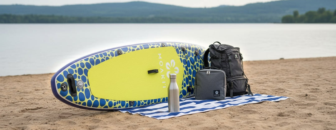 Moaki'i Trekker on the beach with a backpack, highlighting its lightweight ~18 lb portability.