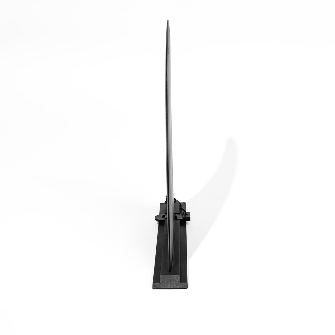 Black replacement fin for paddleboard on a white background