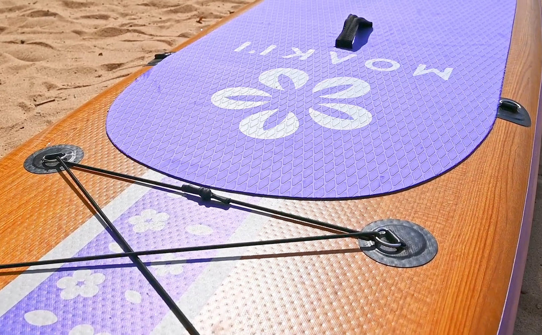 Close-up of the front-mounted 4-point bungee system for securing dry bags and gear on the Pathfinder.