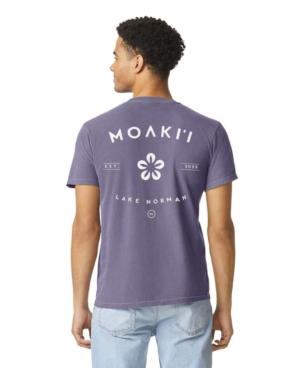 Person wearing a purple t-shirt with 'Moaki'i Lake Norman' text and logo on the back.