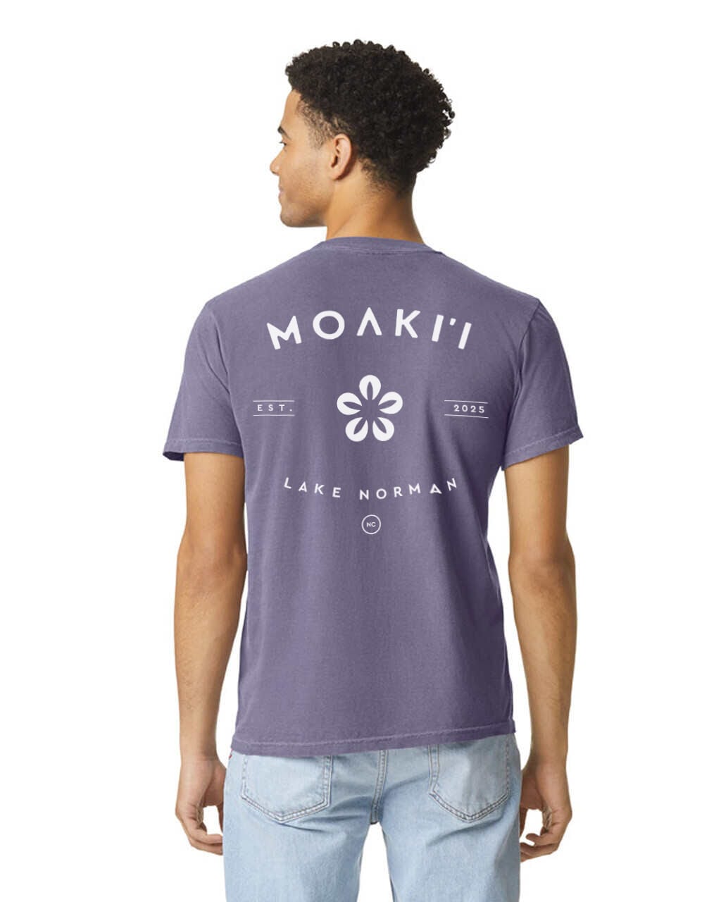 Person wearing a purple t-shirt with 'Moaki'i Lake Norman' text and logo on the back.