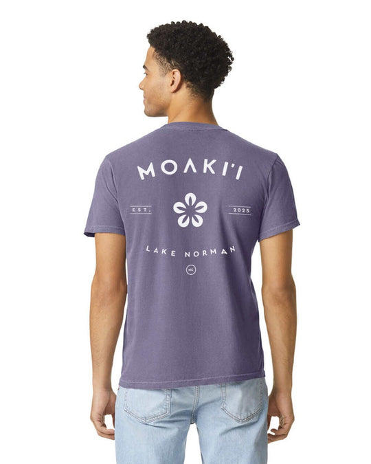 Person wearing a purple t-shirt with 'Moaki'i Lake Norman' text and logo on the back.