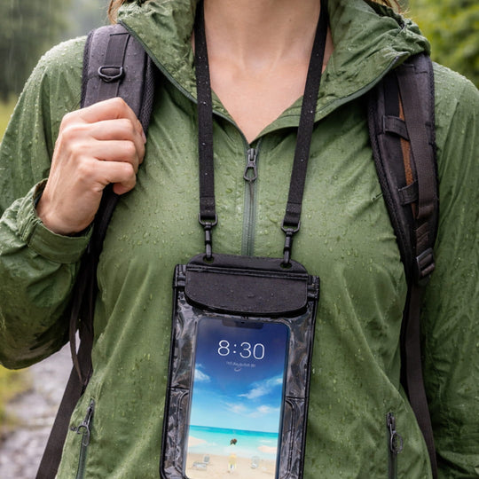 Close up of a hiker wearing the Moaki’i phone pouch during a rainy outdoor adventure.