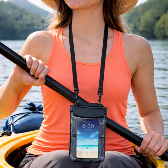 A woman kayaking while wearing the Moaki’i waterproof phone holder with an adjustable neck strap.