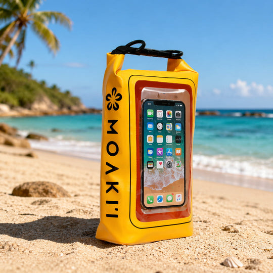Yellow MOAKII phone case with a smartphone on a beach