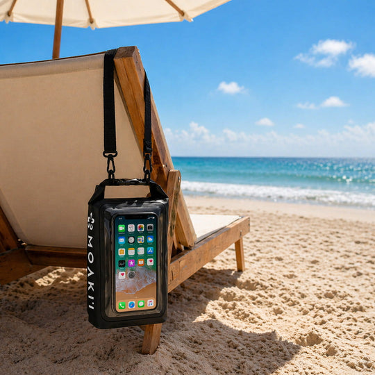 Phone case with smartphone on a beach chair by the ocean