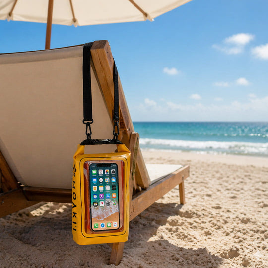 Yellow waterproof phone case on a beach chair with ocean view